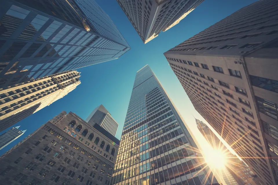 Looking up at high-rise office buildings in New York City.